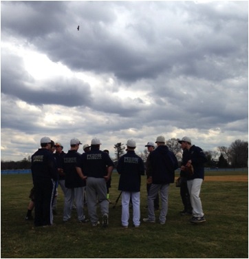 The team circles up for a pre-practice pep talk.