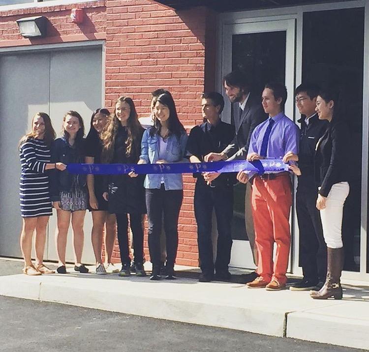 Dean Kamen cutting the ribbon to 
the new digital Fabrication Lab with 
a select group of students and the robotics teacher, Scott Meredith