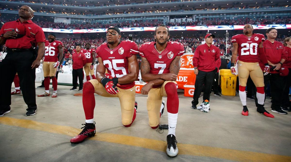 Colin Kaepernick takes a knee during the national anthem. Photo courtesy Sports Illustrated.