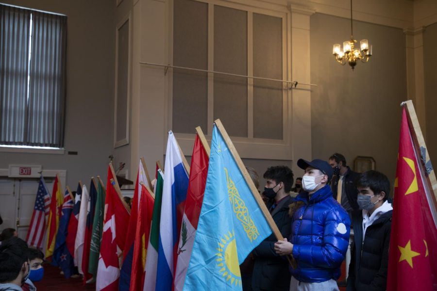 Students hold their respective flags during the International Awareness Week Chapel.