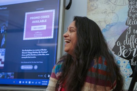Dr. Shah shares a laugh with students during English class.
