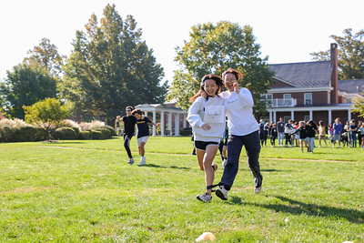 Freshmen compete against each other in the three-legged race.