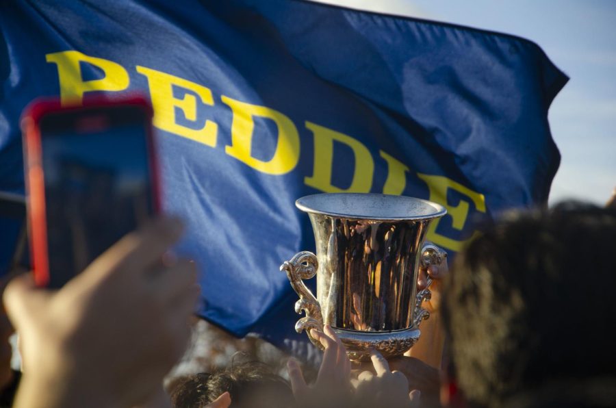 Potter Kelley Cup dances in a sea of students after Peddie brings home the cup.