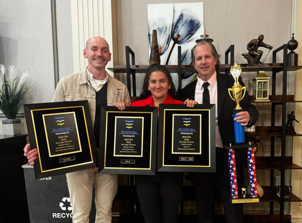 Art Department Chair and Director of Music Mr. Michaels (right), Director of Choral Music Ms. Green (middle) and Assistant Director of Choral Music Mr. Krieger (left) pose with ensemble awards from the Heritage Festival.