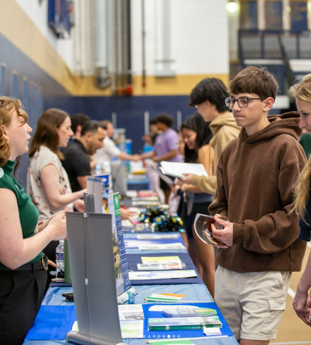 Students discussing with college representatives at the college fair. Peddie Instagram